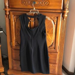 Above knee. Black sleeveless dress